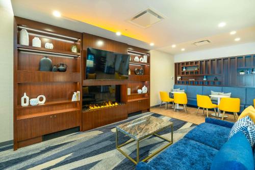 a living room with a couch and a table at Comfort Suites Kelowna in Kelowna
