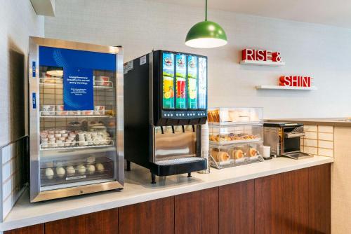 a fast food restaurant with a rise and shine refrigerator at Comfort Suites Kelowna in Kelowna