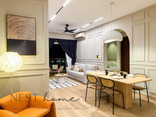 a living room with a table and a couch at Country Garden Seaview Suite by Nest Home at Danga Bay in Johor Bahru