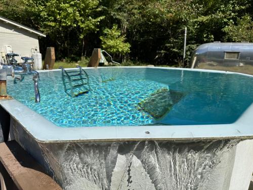 a pool of water with a sink in it at Cozmo in Nikko