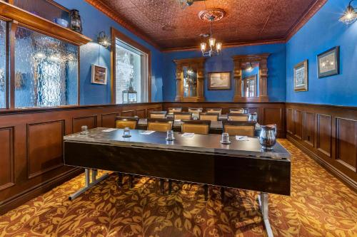 a conference room with a table and chairs in it at The Parlour Inn, an Ascend Collection Hotel in Stratford