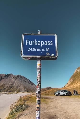 a sign that reads fukazas on the side of a road at Larix in Ulrichen