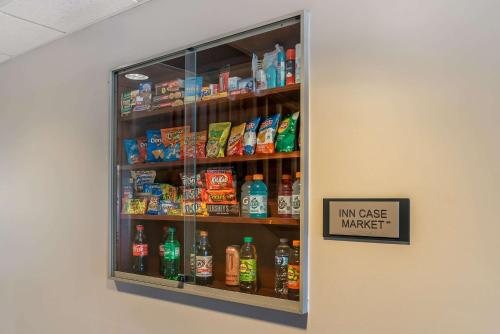 a refrigerator filled with lots of drinks and a sign at Country Inn & Suites by Radisson, Rossford - Toledo South in Rossford