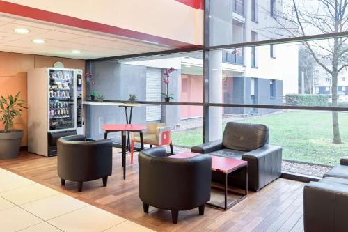 Area soggiorno di Comfort Aparthotel Versailles, St Cyr l'Ecole