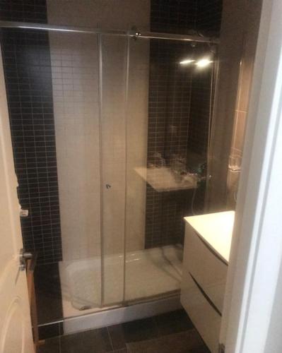 a shower with a glass door in a bathroom at Villa Corazon in Torrevieja