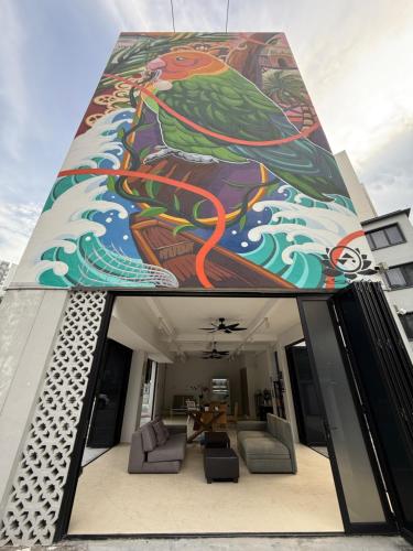 a building with a painting on the side of it at ISA Hotel Amber Road in Singapore