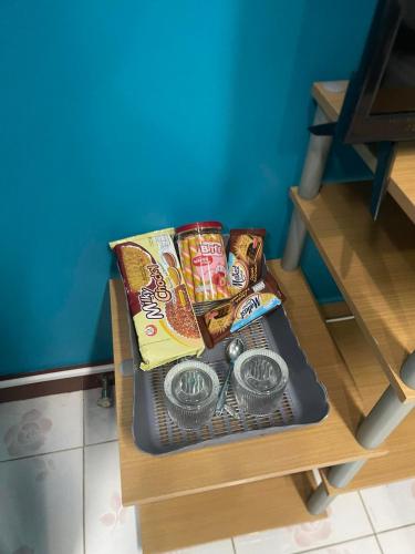 a table with some food on top of it at Ciao Bella GuestHouse & Bistro in Kata Beach