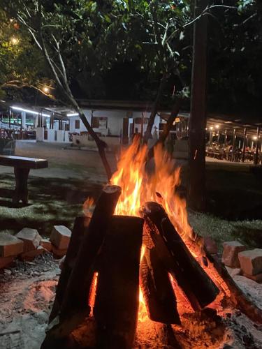 a fire pit in a park at night at FLAT 228 - Hotel Pedra do Rodeadouro-Bonito-PE in Bonito