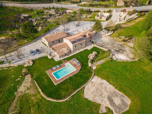 an aerial view of a house with a swimming pool at Quinta da Abadia in Mangualde