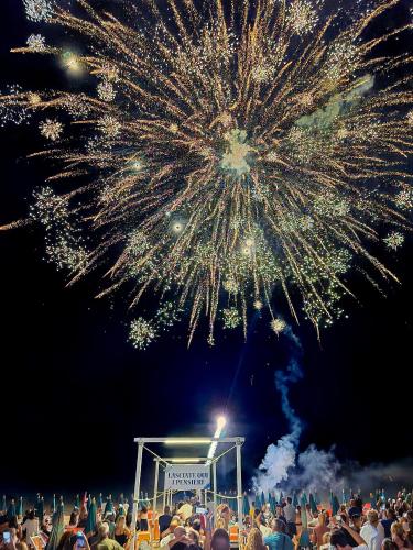 a crowd of people watching a fireworks show at Villaggio Porticello Mare in Vieste