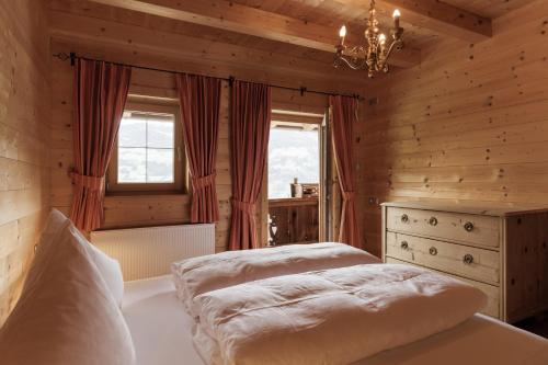 Postel nebo postele na pokoji v ubytování Alpen-Chalet-Pankraz