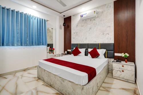 Ένα ή περισσότερα κρεβάτια σε δωμάτιο στο HOTEL SKY BLUE AND SUITEs