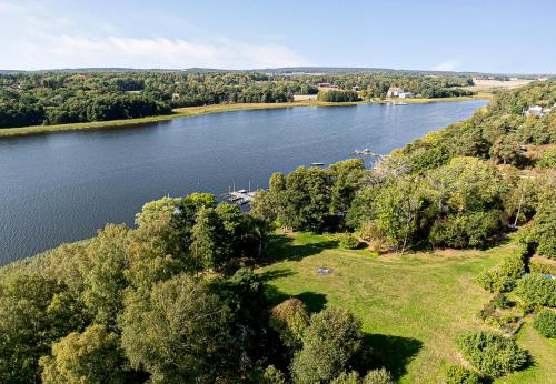 an aerial view of a river with trees and water at Dream location with lake view & Top location near in Bro