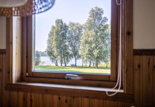 a window in a room with a view of a park at Dream location with lake view & Top location near in Bro