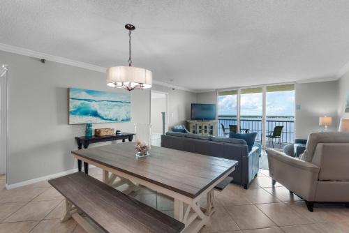a living room with a table and a couch at Tristan Towers unit 14D in Pensacola Beach
