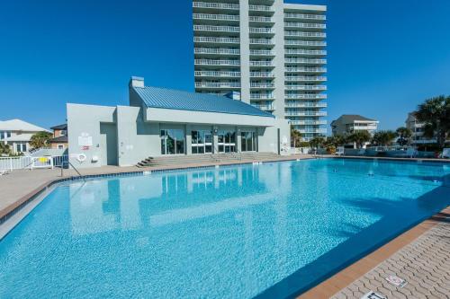 a large swimming pool in front of a building at Tristan Towers unit 5A in Pensacola Beach