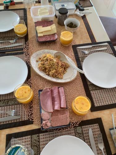 a table with plates of food on a table at Pajaree and Udo‘s Happy Homestay in Trang