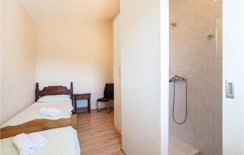 Katil atau katil-katil dalam bilik di Three-Bedroom Apartment In Ostrvica