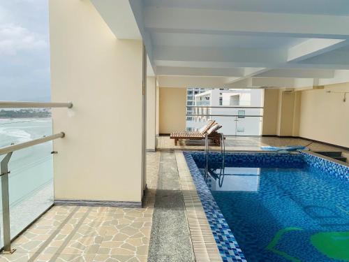 a swimming pool in the middle of a building at Lenid Ocean View Hotel in Nha Trang