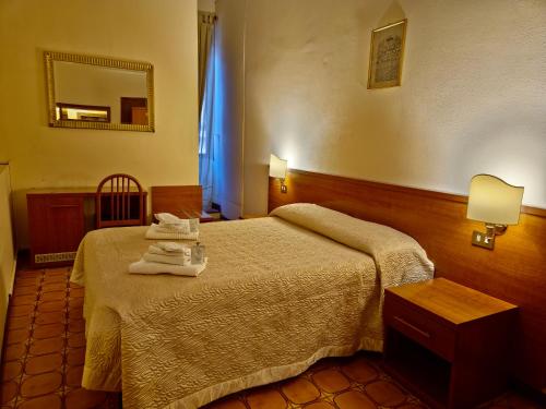 Postel nebo postele na pokoji v ubytování Hotel Azzurra