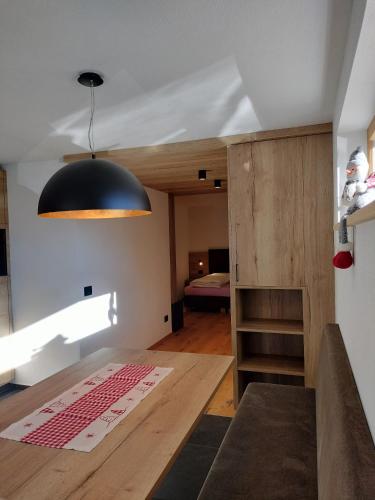 a room with a large black light hanging from the ceiling at Ciüf de Munt in Badia