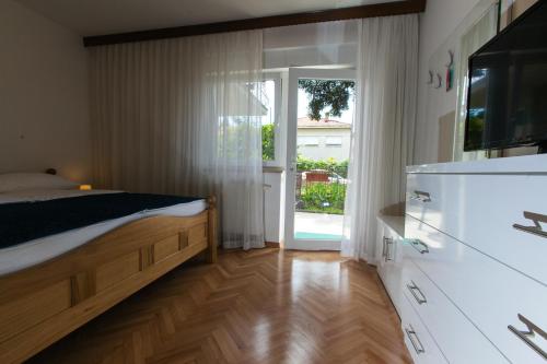 Kuchyňa alebo kuchynka v ubytovaní Apartments Ursic