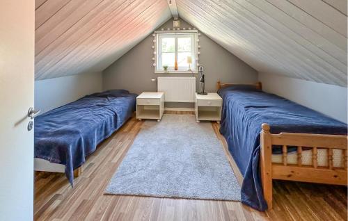 Ένα ή περισσότερα κρεβάτια σε δωμάτιο στο 3 Bedroom Lovely Home In Unnaryd