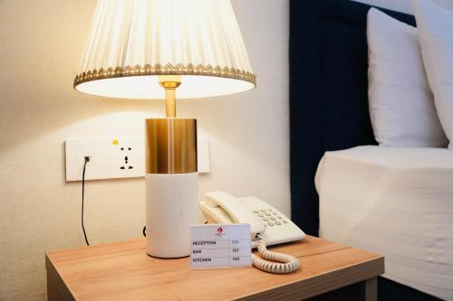 Кровать или кровати в номере Garnet Mir Hotel