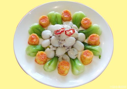 a white plate of food with green beans and popcorn at Lotos Inn & Suites, Nairobi in Nairobi