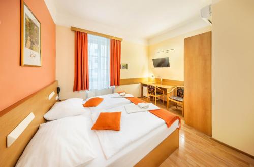 Postel nebo postele na pokoji v ubytování Residence Tabor