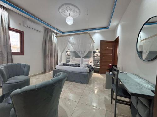 Ein Bett oder Betten in einem Zimmer der Unterkunft Zarafah