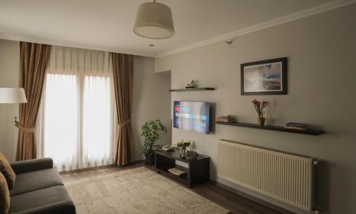 TV a/nebo společenská místnost v ubytování Belle Maison Hotel&Residence