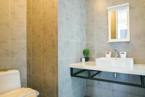 a bathroom with a sink and a toilet at Home Sweet Home at Robertson Bukit Bintang,TRX,KLCC in Kuala Lumpur