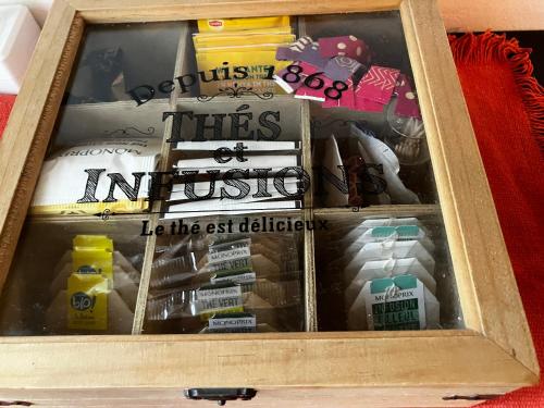 a wooden box filled with different types of food at Trouville Palace Le Bonheur in Trouville-sur-Mer