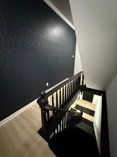 a staircase with a blue tiled wall and a stair case at Luxury Boutique Home - 4 Beds 1 Baths 25 minutes to NYC in Jersey City