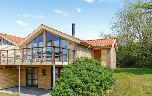 a house with a large deck on top of it at Marina Minde in Egernsund