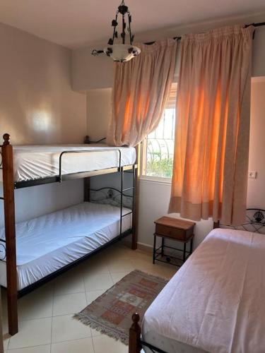 Katil atau katil-katil dalam bilik di Appartement convivial -Marrakech