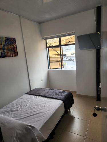 Ένα ή περισσότερα κρεβάτια σε δωμάτιο στο Hotel Plaza