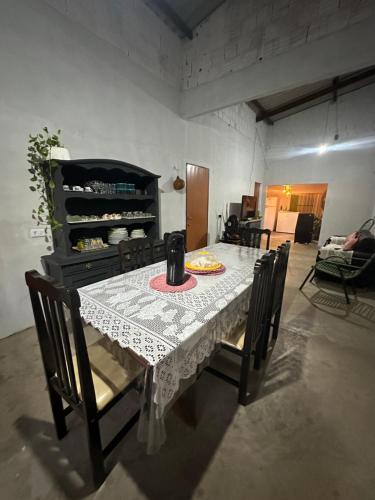 a dining room table with chairs and a table and a table and chairsktop at Pousada Moranga in Carolina