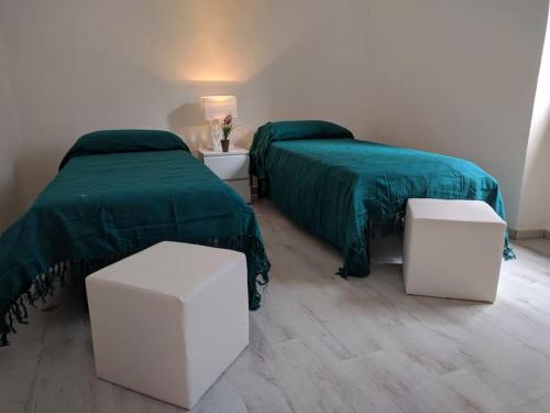 Postel nebo postele na pokoji v ubytování Appartamento Bosa