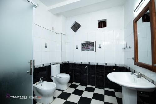 a bathroom with two toilets and a sink at Casa Suite Seenigama - Hikkaduwa in Hikkaduwa