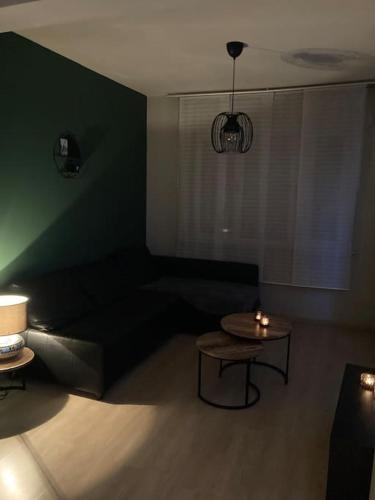 Ruang duduk di Maison très confortable