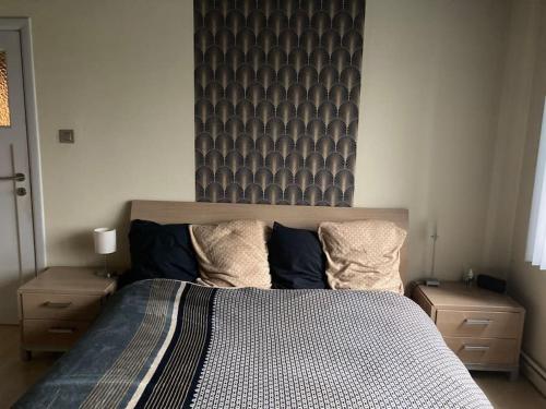 Katil atau katil-katil dalam bilik di Maison très confortable