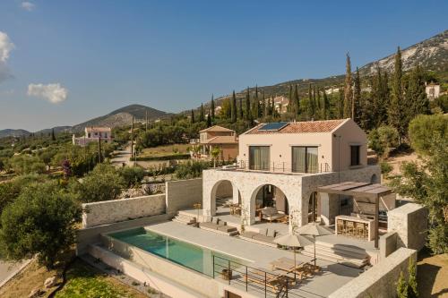 an aerial view of a villa with a swimming pool at Kerami Kefalonia in Kefallonia
