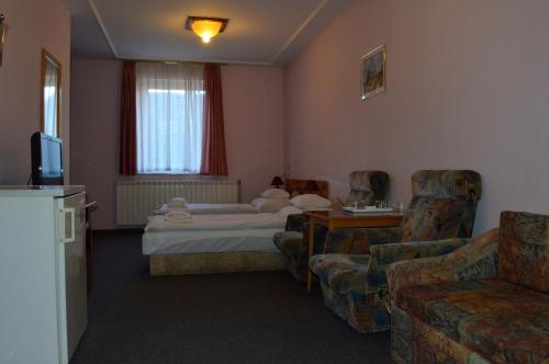 TV a/nebo společenská místnost v ubytování Apollo Motel