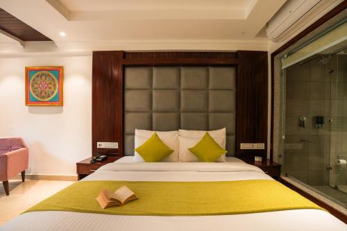 a bedroom with a large bed and a shower at Alt Life Luxe - Himalayan Crown - Dharamkot Mcleodganj in Dharamshala