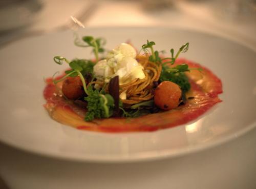 a plate of food with pasta and vegetables on it at Schloss Oppurg in Oppurg