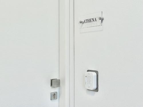 a white door with a hello sign on it at Trotto e Galoppo Rooms in Arezzo