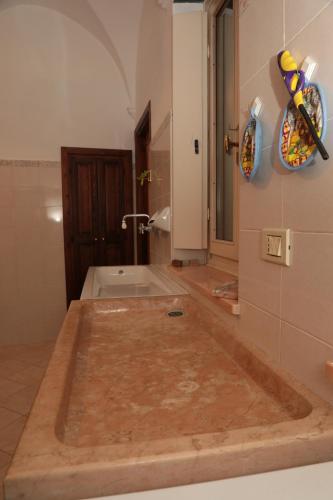 a bathroom being remodeled with a tub in the floor at casa margherita in Pieve di Teco