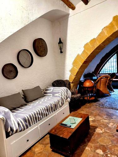 a living room with a couch and a table at La Querala in Cabanes